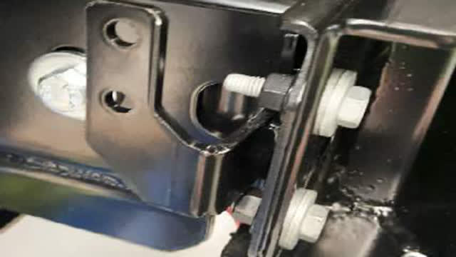 <p>Using supplied new bracket and hardware, attach horn and bracket together, securing in place on cradle as shown using original factory bolts.</p>
<p>Reconnect horn plug.</p>