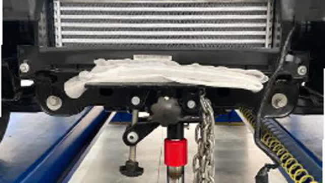<p>Support intercooler with workshop stands and
remove outer tie down points / intercooler
support brackets.
Retain the bolts for later use.</p>