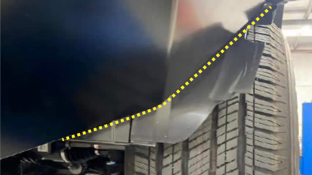 <p>Hold the wing protection plate in position and mark the guard liner to be trimmed. Trim guard liners.</p>
<p>Repeat procedure on opposite side</p>