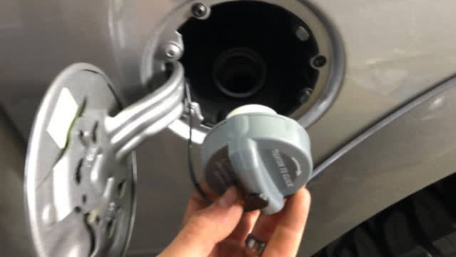 Open fuel door, and remove cap