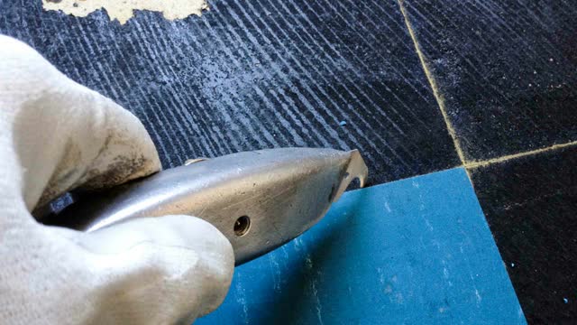 <p>Gently scrape up mastic. You can soften mastic with solvent.</p>