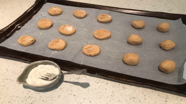 <p>Roll large teaspoon full into balls and press flour dipped fork in a crisscross pattern. Bake at 375f or 180c oven for 10 minutes.</p>