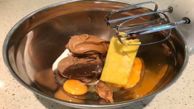 <p>Mix sugars, butter, peanut butter and egg.</p>