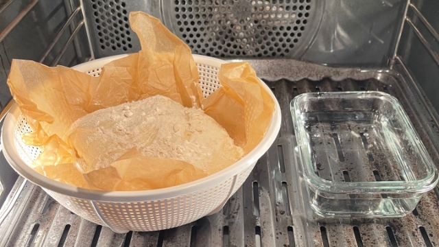 <p>Remove the dough from the refrigerator and place it in a warm area (ideally 26-27C) or in the oven on the lowest temperature together with a small container of warm water to help keep the area moist.</p>
<p>Let it rest for one to two hours until it has gained a third or half its size.</p>