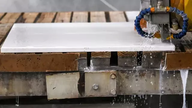 <h4>Water Suppression (1)</h4>
<p>Only use tools and machinery that have been specifically designed for use with water attachments:</p>
<ul>
<li>Use bridge saws fitted with water attachments to suppress dust when cutting slabs.</li>
<li>Use water suppressed routers, water jet cutters or bridge saws to complete sink and stovetop cut outs.</li>
</ul>