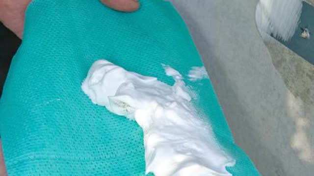 <p>Remove the wipe from the wall.</p>
