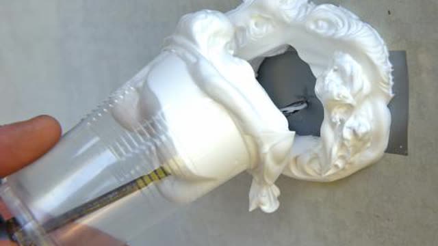 <p>While holding the drill and the cup, place the point of the drill bit on the marked drilling point. Slide the cup with the shaving foam down the drill bit and proceed to drill the hole at low speed.</p>