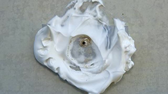 <p>After the hole is drilled, remove the plastic cup and dispose of it in an approved asbestos waste bag which is correctly labelled and is 200 µm thick. The asbestos residue will be captured in the shaving cream around the drilled hole.</p>
