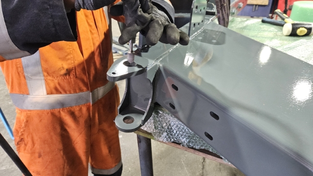 <p>Have pivot clevis hanging off the pallet so top and bottom holes can be die-ground out for pin to fit if needed.</p>
