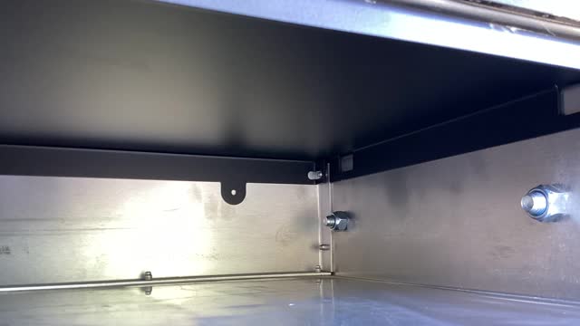 <p>Ensure the locating slots are over the rivets in the corners.</p>