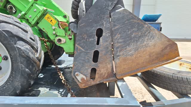 <p>Retract boom and position bucket at a slight rearward tilt, and then lower bucket onto the front rail. This will gently push the machine back into the tensioned chains. Re-apply the park brake.</p>
