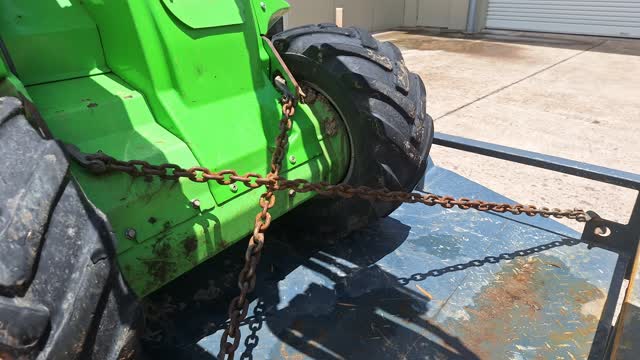 <p>Release the park brake, then reverse the machine until chains are taut - this sometines requires a small movement of the steering wheel to even up the chain tension.</p>
