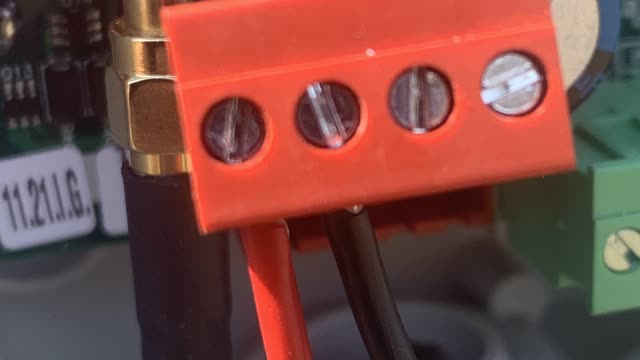 <p>Connect the end wires into the red connector like this.
Red wire on left.
Black next to it.</p>
