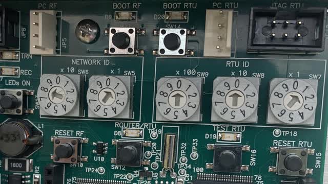 <p>Inside each box are 5 grey dials with arrows pointing to a number.
This unit is:
Network ID 81
RTU ID 001</p>
