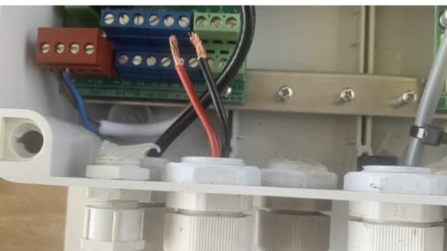 <p>There is a short connector wire coming out of the big box.
Push the end of the wire up into the little box.</p>
