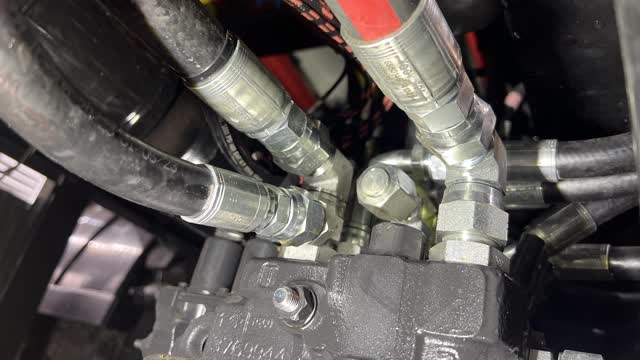 <p>Disconnect and cap hoist up hose</p>