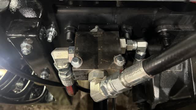 <p>While still stroking out hoist up, adjust the pressure reducing valve counter clockwise to decrease pressure to 175 Bar</p>