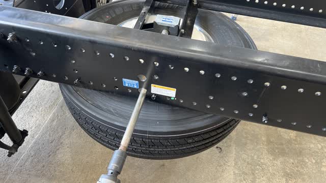 <p>Using a 30mm socket and the tyre removal tool, lower the spare tyre and place on a pallet to be stored until the completion of truck.</p>