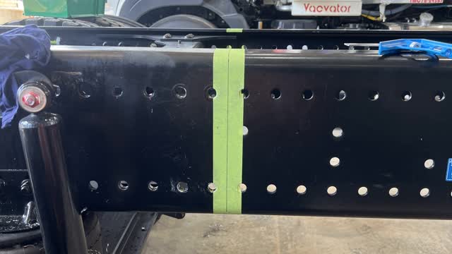 <p>Measure half way between holes 96 & 97 and project a square line down the chassis on both sides as shown.</p>