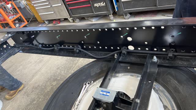 <p>Untie rear light harness from chassis extension and tie up in front of the second last cross member</p>