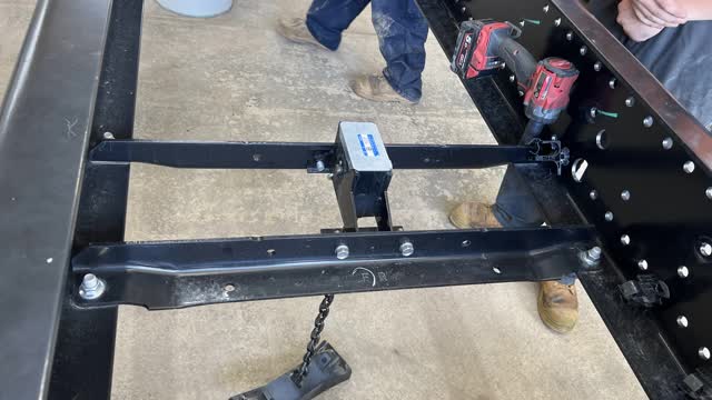<p>Remove spare tyre carrier and place in the bin.</p>