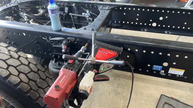 <p>Set Mag drill up with a 16mm Broach cutter and drill 4x holes through crossmember to allow bolts to go through for subframe mounting.</p>