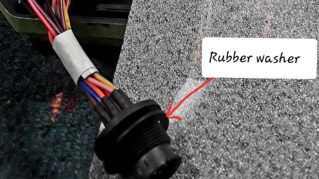 <p>Apply primer to the channels of both enclosures to improve glue adhesion. Also, make sure the monitor cable has a rubber washer installed.
Tip: If you haven’t applied the glue yet, reapply the primer after 30 minutes.</p>