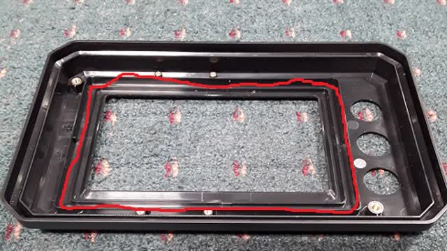 <p>Time to Glue the Glass onto the Top Case. Begin by cleaning the channel inside the top case with isopropyl alcohol. Once the channel is dry, apply tape primer to the area to enhance adhesion.</p>