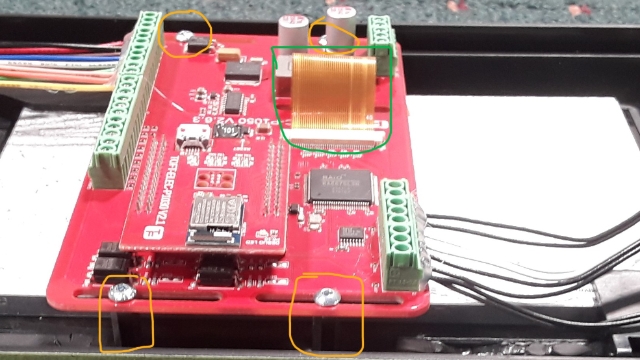 <p>Install 4 brass standoffs in the designated locations.</p>
<p>Mount the PCB PCB TOFT-ELEC-P1050 for Incab onto the standoffs and connect the yellow display (highlighted in green).</p>
<p>Secure PCB with 4 M3 x 6 socket button screws (SS). Apply thread locker to screws and tighten them securely.</p>
