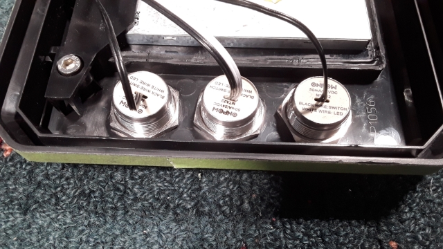 <p>Use two No LEDs and one Blue LED switch.Remove lock nut from LEDs and attach black rubber washer on each switch. Position the Blue-LED switch between the two No LED switch as shown in the photo. Finish by reattaching locknuts and tighten them.</p>