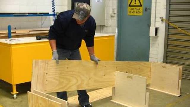 <p>Place timber board into the holding frames. This will line up the coffin box into position.</p>