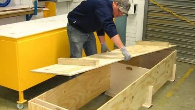 <p>Place the bottom of the box with the legs onto the main coffin box..</p>