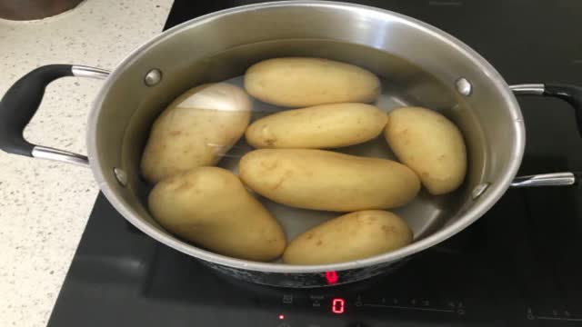 <p>Cook potatoes in skin; cool.</p>
<p>Tip: Cook until skewer just goes through, you want them still firm enough to grate. Cook them too long and you will have mush.</p>
