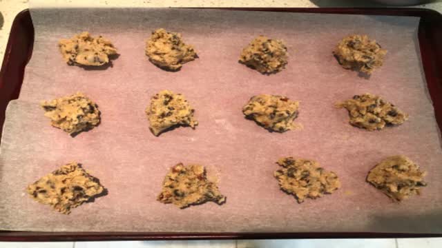 <p>Drop by rounded tablespoons on ungreased baking trays.
Cooks tip. If your cookie dough starts to get really soft while waiting to make the next batch pop it in the fridge for 10 minutes so the cookies retain a better shape.</p>