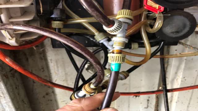 <p>Undo the hose with the green tape on it first</p>