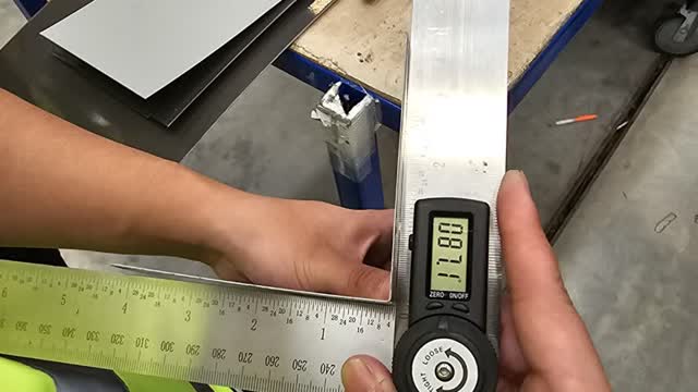 <p>Remove steel samples from folder and check angle using electronic protractor.</p>