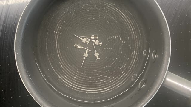 <p>Regularly change your needle to ensure it is clean.
Don't use meths to clean the needles as it may interfere with the vaccine.
Take the used needles home and boil them in water to reuse next time.</p>