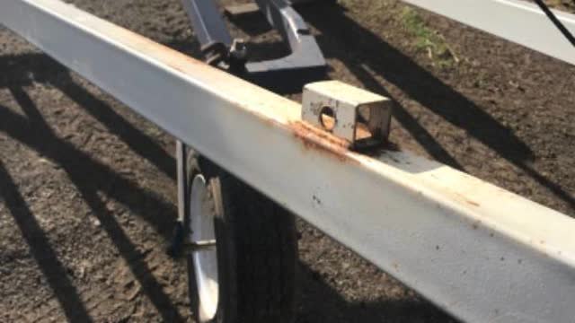 <p>Take drawbar off it’s holder on auger</p>