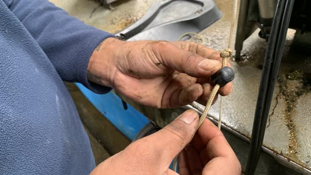 <p>Insert the string through the clip and tie a knot at the end of the string.</p>
