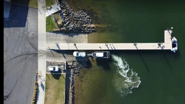 <p>You can get the boat off the trailer a number of ways. Some will use just a rope and tie it to the jetty. I like to power the boat gently forward, then my crew can unhook the last shackle, or I can release my Boatcatch and I'm free to go</p>