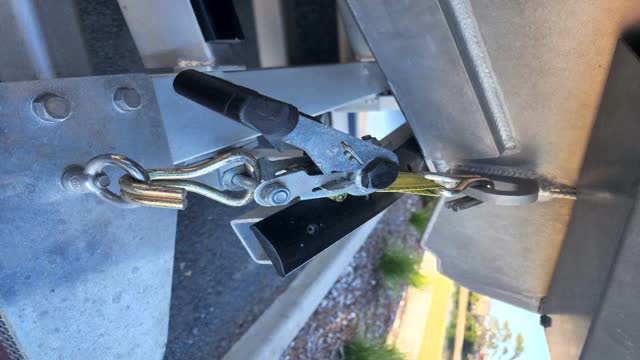 <p>Whist still at the rear, undo any fasteners attaching the boat to the trailer</p>