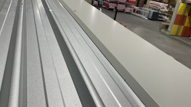 <p>Make sure everything is lined up then screw flashings to the roof on left and right side.</p>
