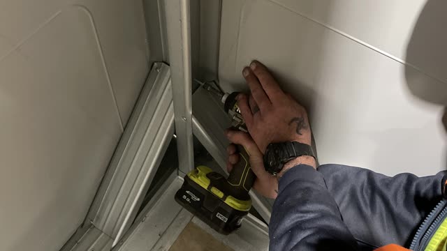 <p>Install the fourth wall and screw off using two tech screws per bay.</p>
