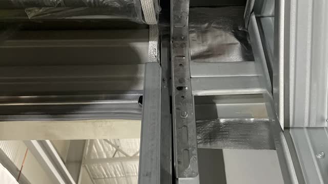<p>Carefully put the bottom of the roller door in the roller door track.</p>
