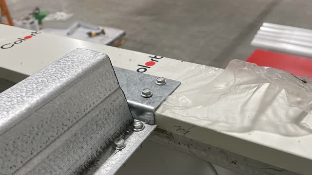 <p>Measure 1200 from the back of the shed to the centre of the bracket and fit bracket to both sides of the shed. Cut and install top hat to the bracket.</p>
