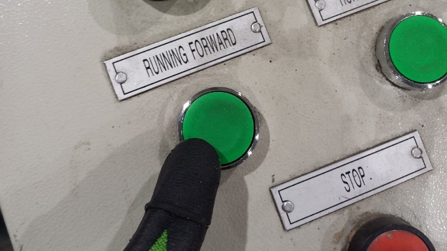 <p>Press the green Running Forward button to jog the coil through the machine.</p>
