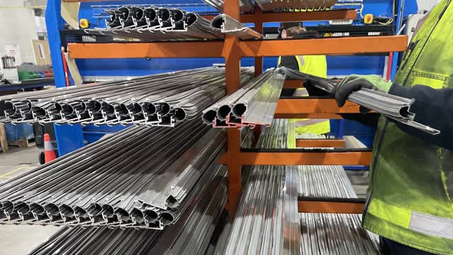 <p>Unclamp the bottom rail and put it on the rack. Make sure to put it in the correct length section.</p>