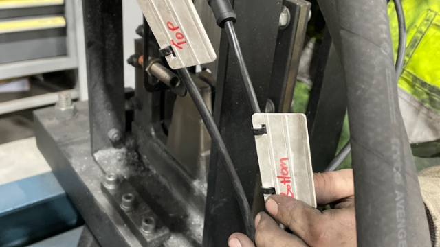 <p>Attach your Guillotine sensor cables. <strong>Make sure the one with the top label is at the top and the one with the bottom label is at the bottom and make sure to tighten them.</strong></p>