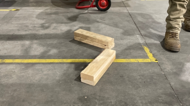 <p>Place wooden glutts on the ground. [this is to ensure you dont lower the casette onto the cone and tip the cassette.]</p>

