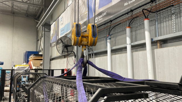 <p>Using the crane, carefully lift the cages off the machine.</p>